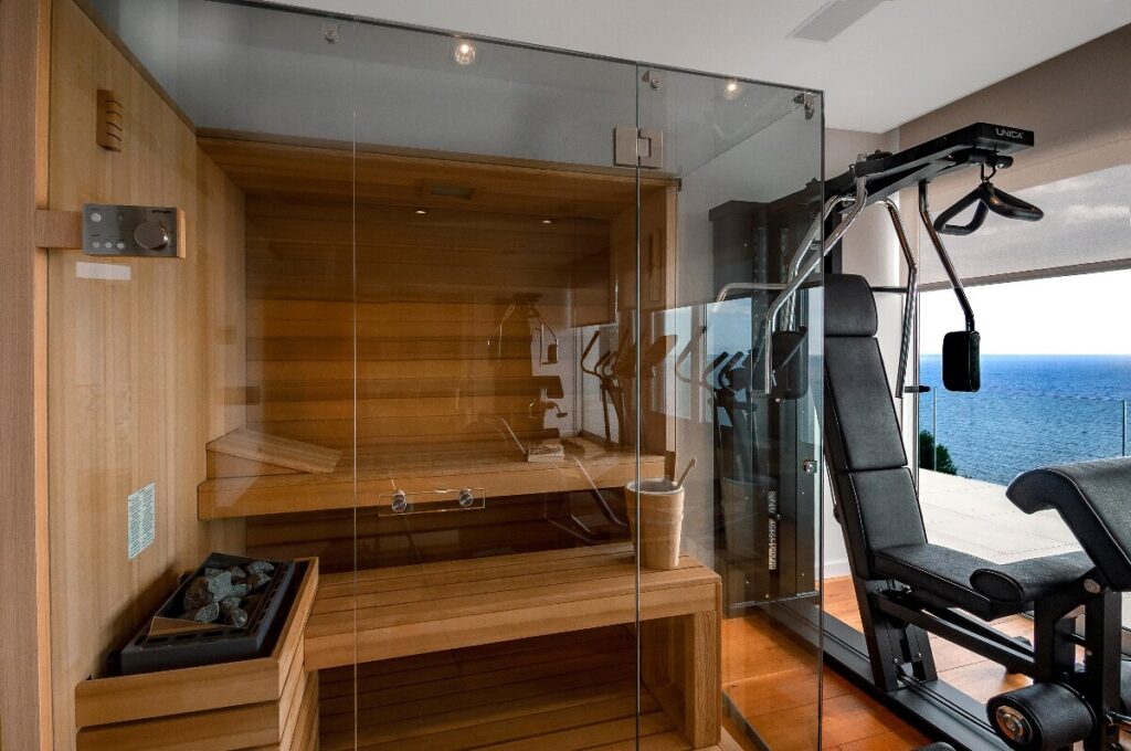 Sauna in wellness room with workout station