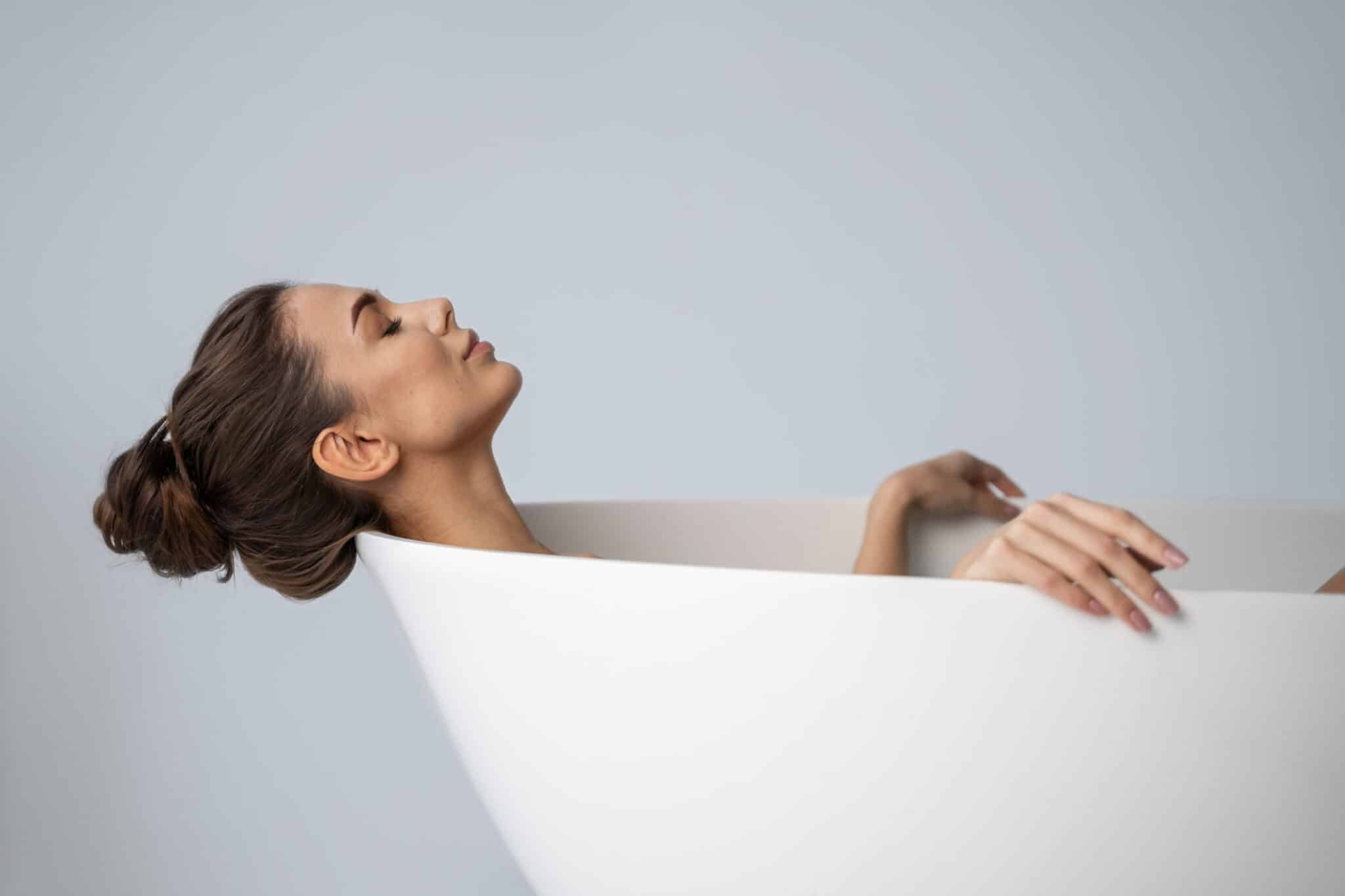 Woman cold plunging to improve mental health