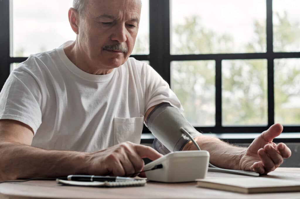 Man testing for high blood pressure before sauna session